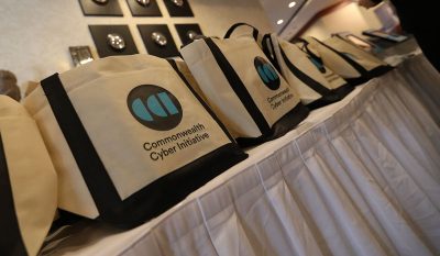 Row of CCI branded bags at 2022 Symposium